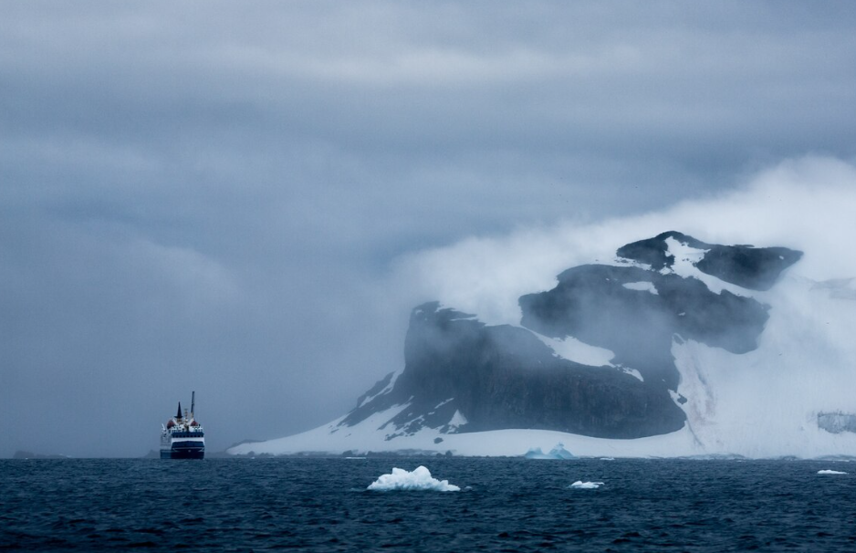 Ocean liner near an iceberg, evoking the Titanic coincidence story.
